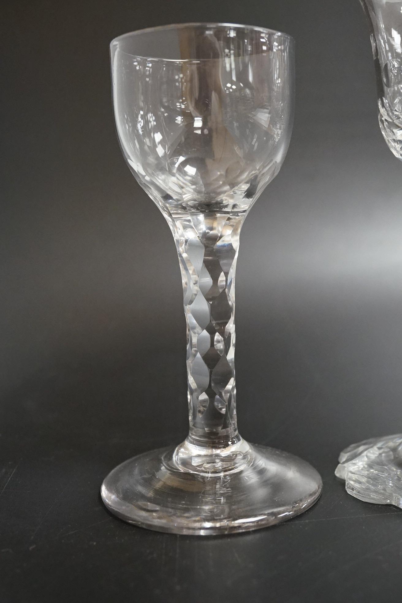 Two faceted wine glasses, c.1775, one with faceted star cut foot, tallest 15cm